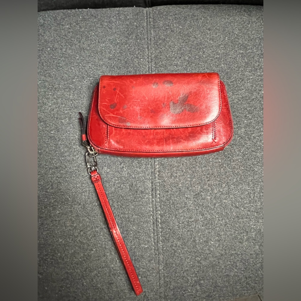 TUMI leather clutch